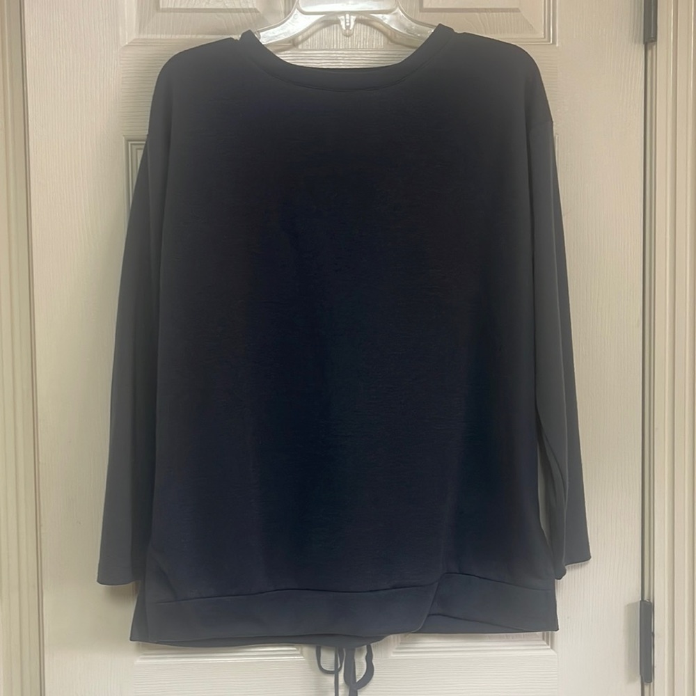 Very J size small top. Back is so cute.Used but really good condition. Dark gray